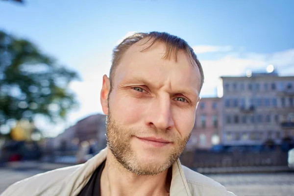 Serious Caucasian male in his 40s with early receding hairline. — Stock Photo, Image