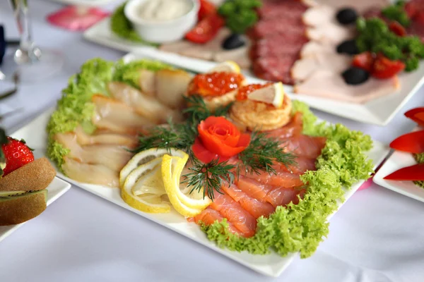 Fish delicacies on laid table — Stock Image Fish delicacies on laid table Stock Picture