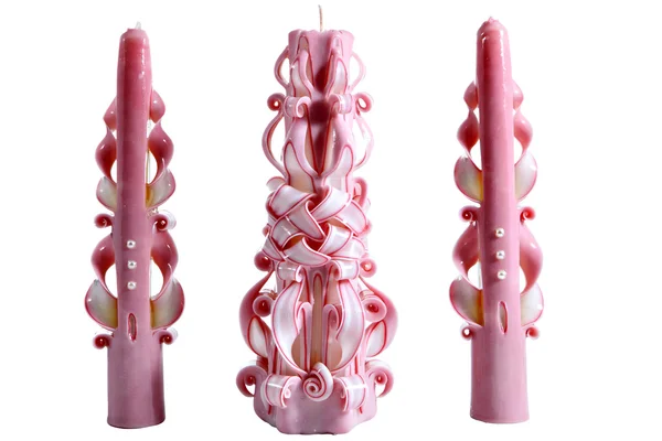 Three pink ribbon carved homemade Christmas candles isolated on — Stock Photo, Image