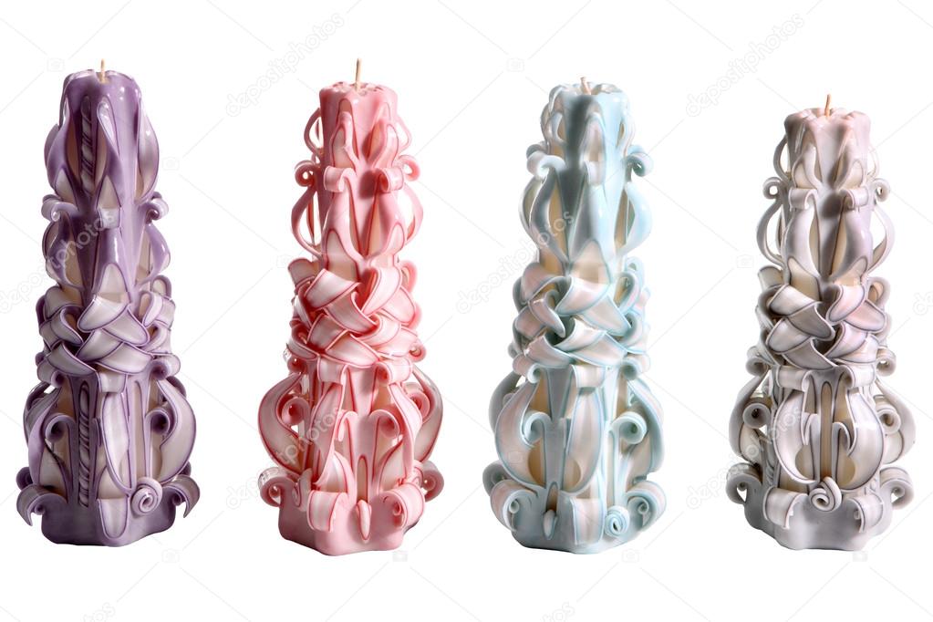 Four Christmas paraffin candle wax carving, isolated on white ba