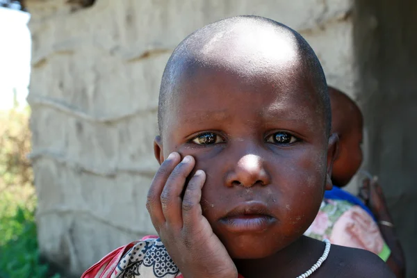 Little black girl with a dirty face, close-up portrait. — Stock Photo, Image