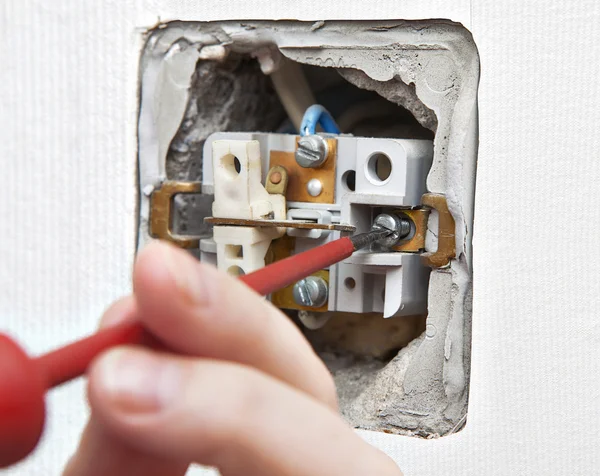 Uninstall the old light switch, closeup. — Stock Photo, Image
