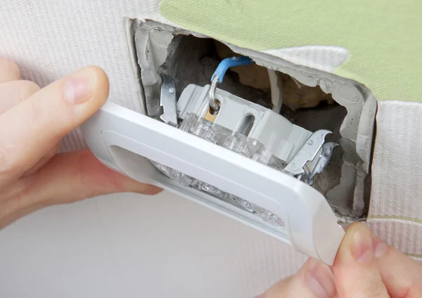 Install wall light switch Insert into electrical box — Stock Photo, Image