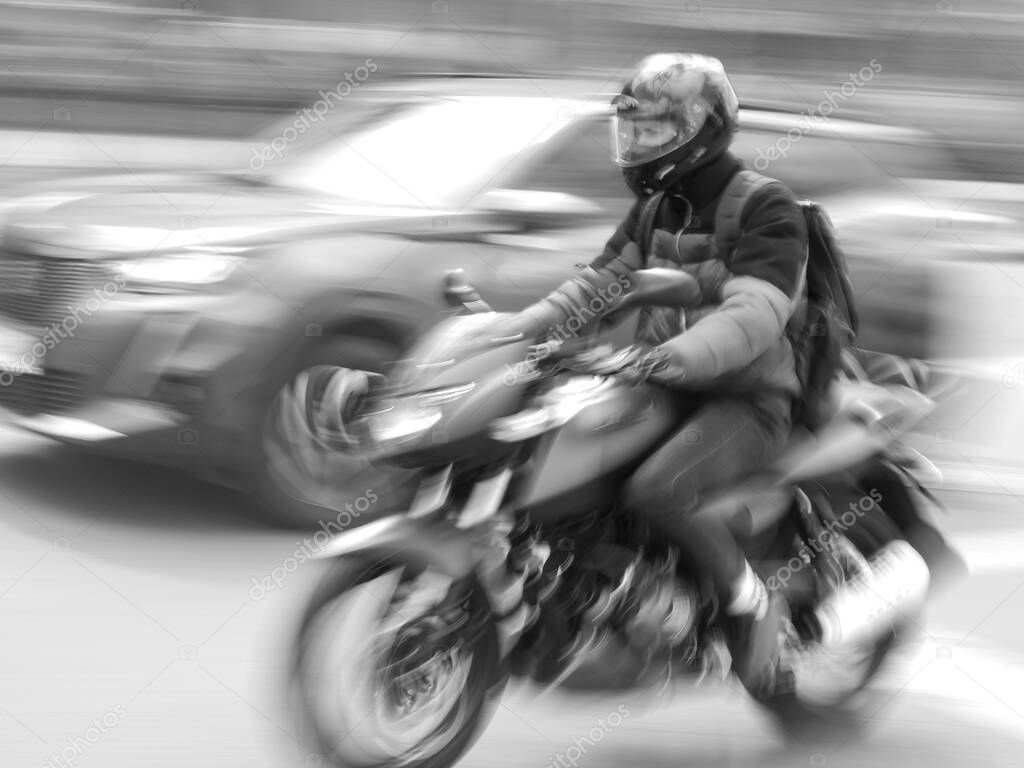 Blurred image of a motorcyclist in motion 
