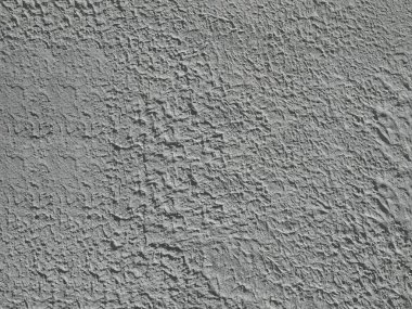 Duvarın kabartmalı yüzeyi alçıyla kaplıydı.