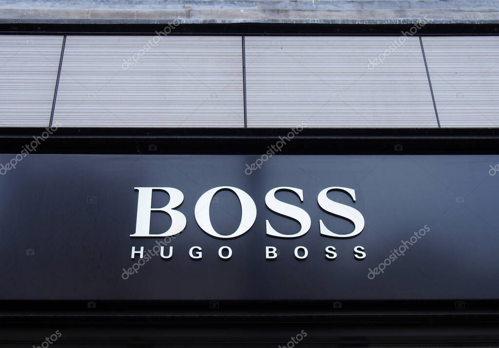 Eeds, west yorkshire, united kingdom - 11 may 2021: sign above the entrance of the hugo boss retail fashion store in leeds city centre