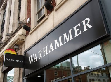 leeds, west yorkshire - 17 June 2021: sign and logo above a warhammer games store store on briggate in leeds city centre