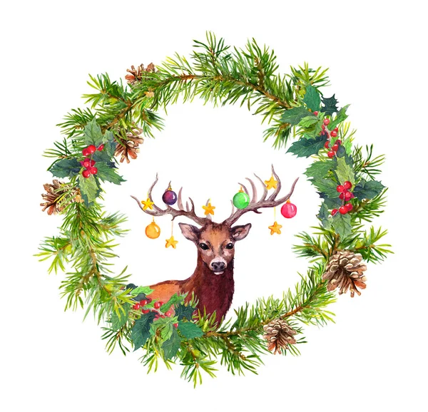 Deer animal with decorative baubles on horns. Christmas watercolor wreath - fir tree branches, mistletoe Stock Picture