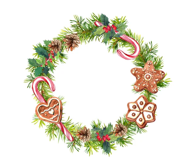 Christmas wreath with gingerbread cookies, candy canes. Watercolor - pine tree branches, mistletoe, cones. — Stock Fotó