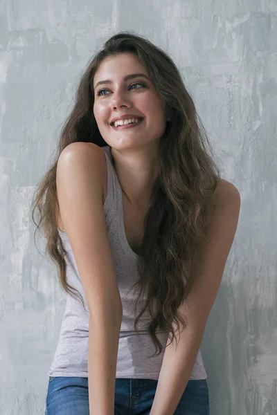 Studio shot of candid brunette smiling away — Stock Photo, Image