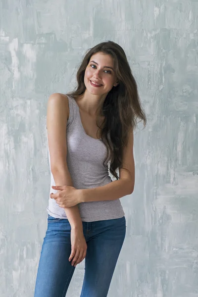 Beautiful brunette with long hair looking at camera — Stock Photo, Image