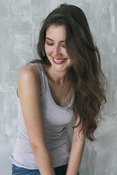 Cheerful brunette smiling with eyes closed — Stock Photo, Image