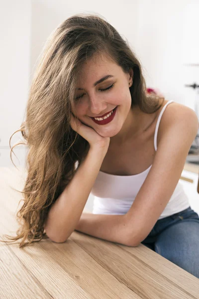 Smiling young brunette with red lips — Stock Photo, Image