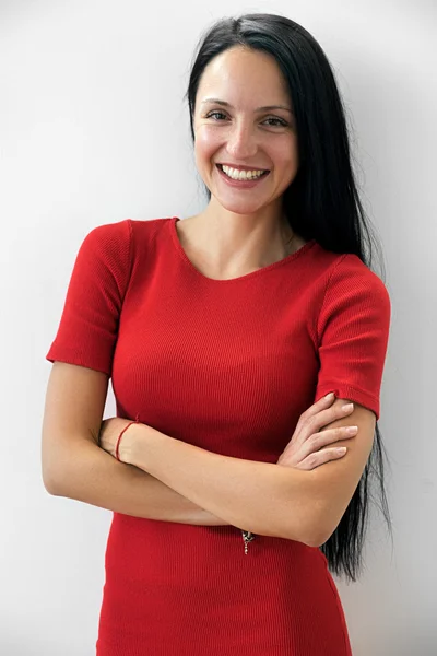 Smiling woman in red dress — Stock Photo, Image