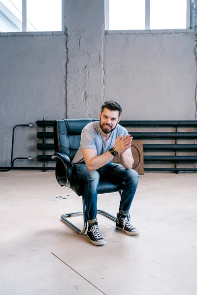 Portrait Smiling Bearded Man Sitting Leather Chair Old Building — Stock Photo, Image
