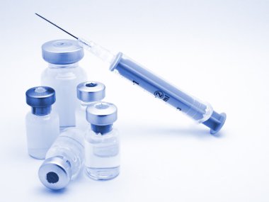Medical syringe and phials clipart