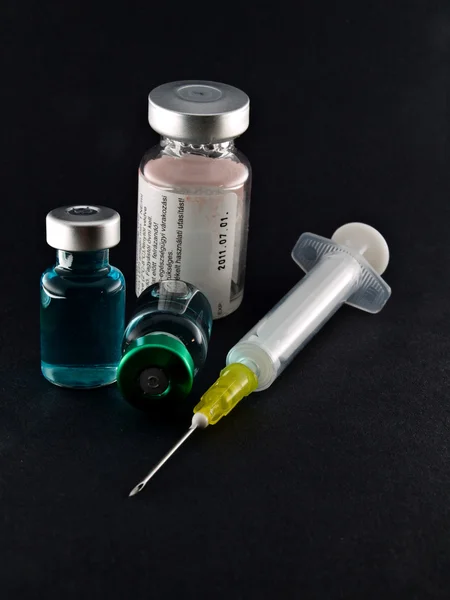 Medical syringe and phials — Stock Photo, Image