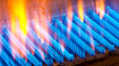 The fire burns from a gas burner. Blue flame when burning gas. clipart