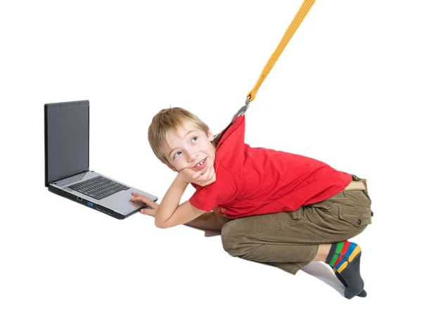 The Internet dependence. The sling pulls the boy from the laptop — Stock Photo, Image