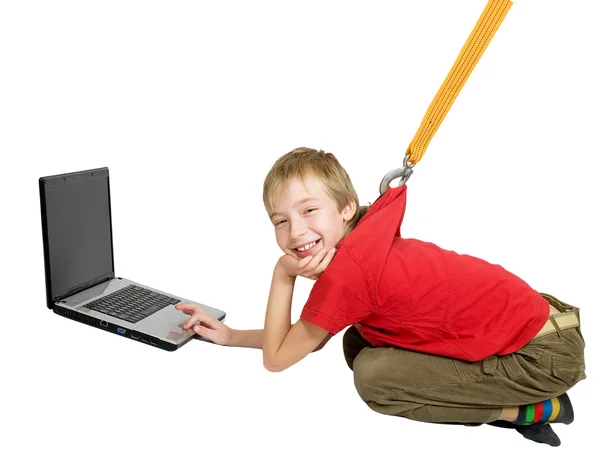 The Internet dependence. The sling pulls the boy from the laptop — Stock Photo, Image