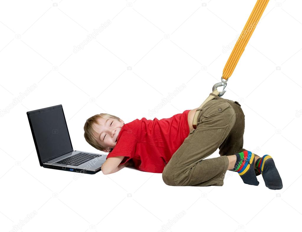 The Internet dependence. The sling pulls the boy from the laptop