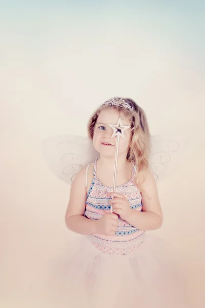 Funny little girl with magic wand — Stock Photo, Image