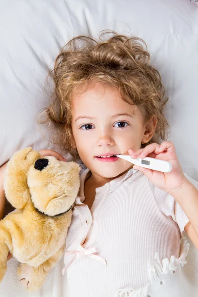 Little girl with thermometer Royalty Free Stock Images