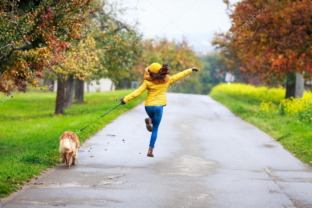 funny girl running with dog friend