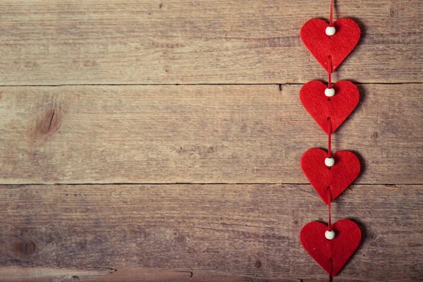 Hearts on the wood background — Stock Photo, Image