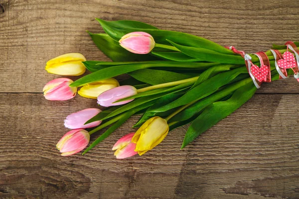 Yellow tulips on the wood — Stock Photo, Image