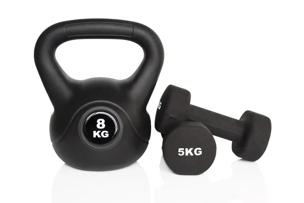 Manubri neri e kettlebell — Foto Stock