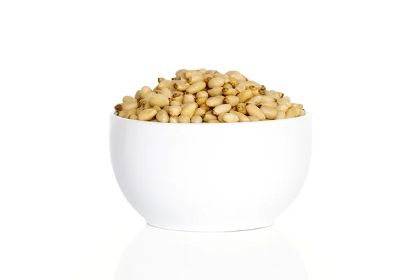 Pine nuts in a cup — Stock Photo, Image