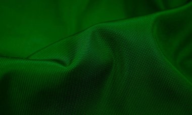 Yeşil kırışık pamuklu kumaş ve görünür detaylar. arkaplan