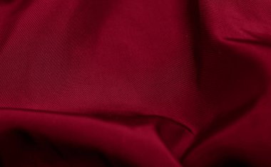 Czerwony Marszczony bawelniany materyali z widocznymi szzegolami. tlo