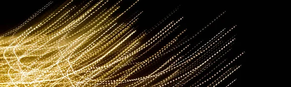 Gouden Streepjes Lichtlijnen Zwarte Achtergrond — Stockfoto