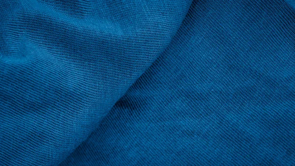 blue cotton fabric with visible details. background