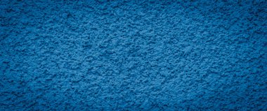 Duvarda mavi gözenekli alçı var. arkaplan