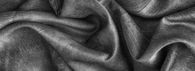 Kırışmış gri pamuk kumaş görünür bir dokusu var.