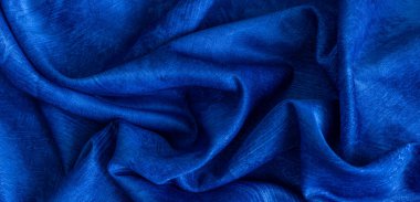 Kırışık mavi pamuklu kumaş görünür bir dokuya sahip.