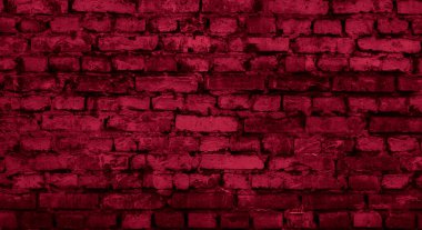 Kırmızı boyayla boyanmış tuğla bir duvar.