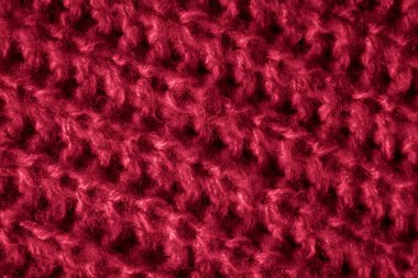 İlginç bir deseni olan kırmızı yün bir madde.