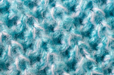 İlginç bir deseni olan mavi yün bir madde.