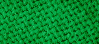 İlginç bir deseni olan yeşil örgülü madde.