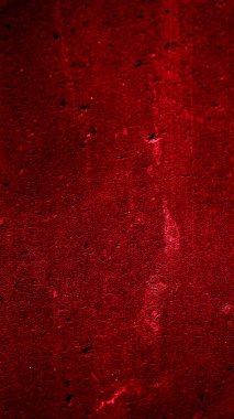 İlginç bir deseni olan kırmızı boyayla boyanmış duvar.