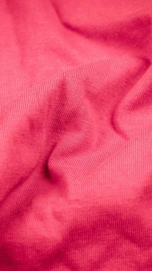 Pembe kırışık kumaş ve görünür detaylar. arkaplan