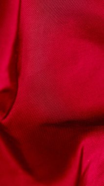 Czerwony Marszczony bawelniany materyali z widocznymi szzegolami. tlo