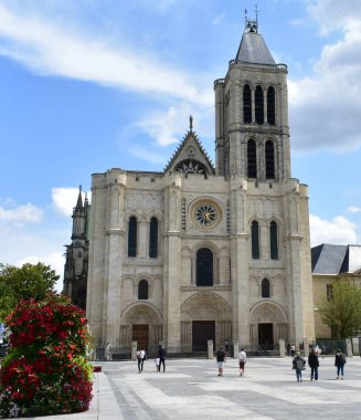 Paris, France. August 12, 2019. Basilica of Saint-Denis or Basilique royale de Saint-Denis, west facade and bell tower.