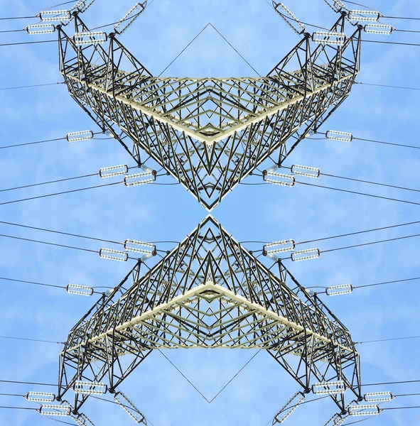 Symmetrical high voltage pylons view from above Royalty Free Stock Images