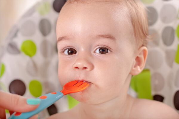 Baby eating watermelon