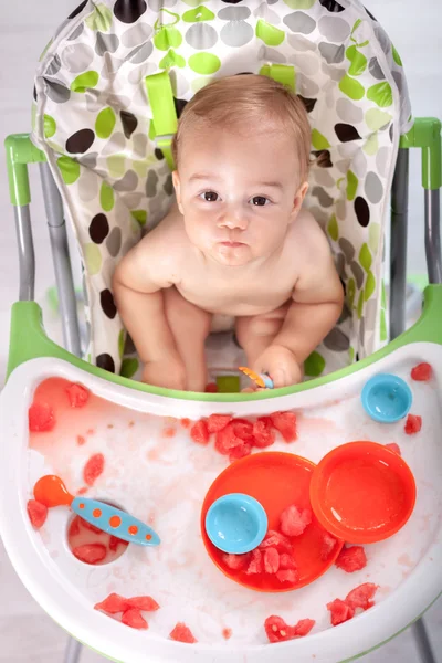 Little baby boy making mess with watermelon — Stock Photo, Image